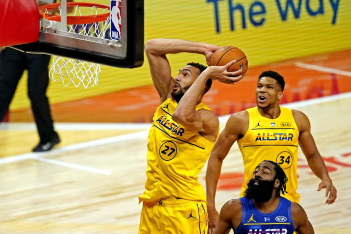 Rudy Gobert (27) dunks over James Harden (blue) during the 2021 ASG